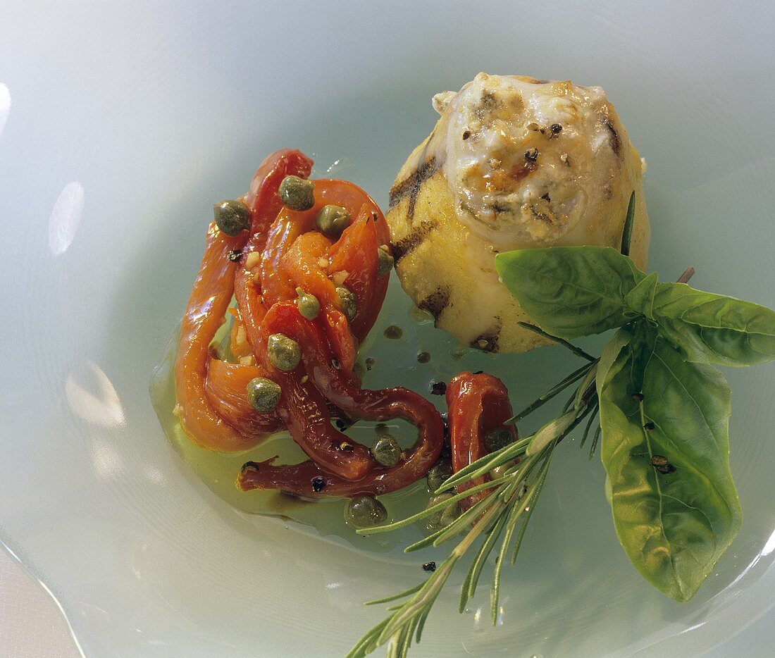 Polenta tower with peppers as accompaniment or snack