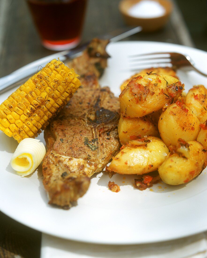 Barbecued lamb cutlet with potatoes and sweetcorn 