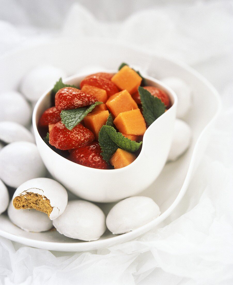 Fruit salad with strawberries, papaya and mint