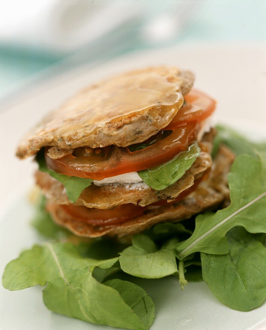 Aubergine pancakes with goat's cheese and tomatoes
