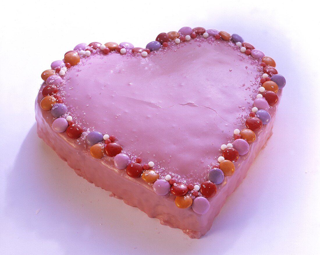 Pink love-heart with smarties and icing