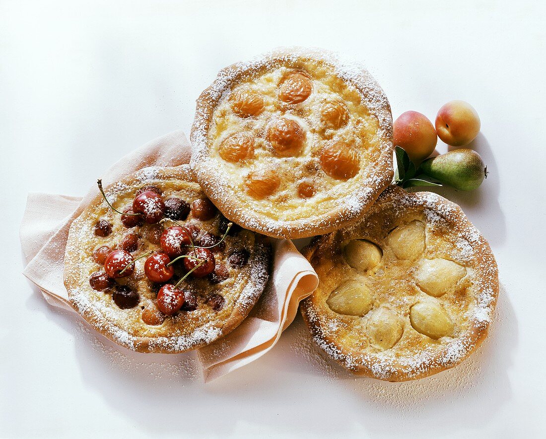 Sweet pizzas with cherries, pears or apricots