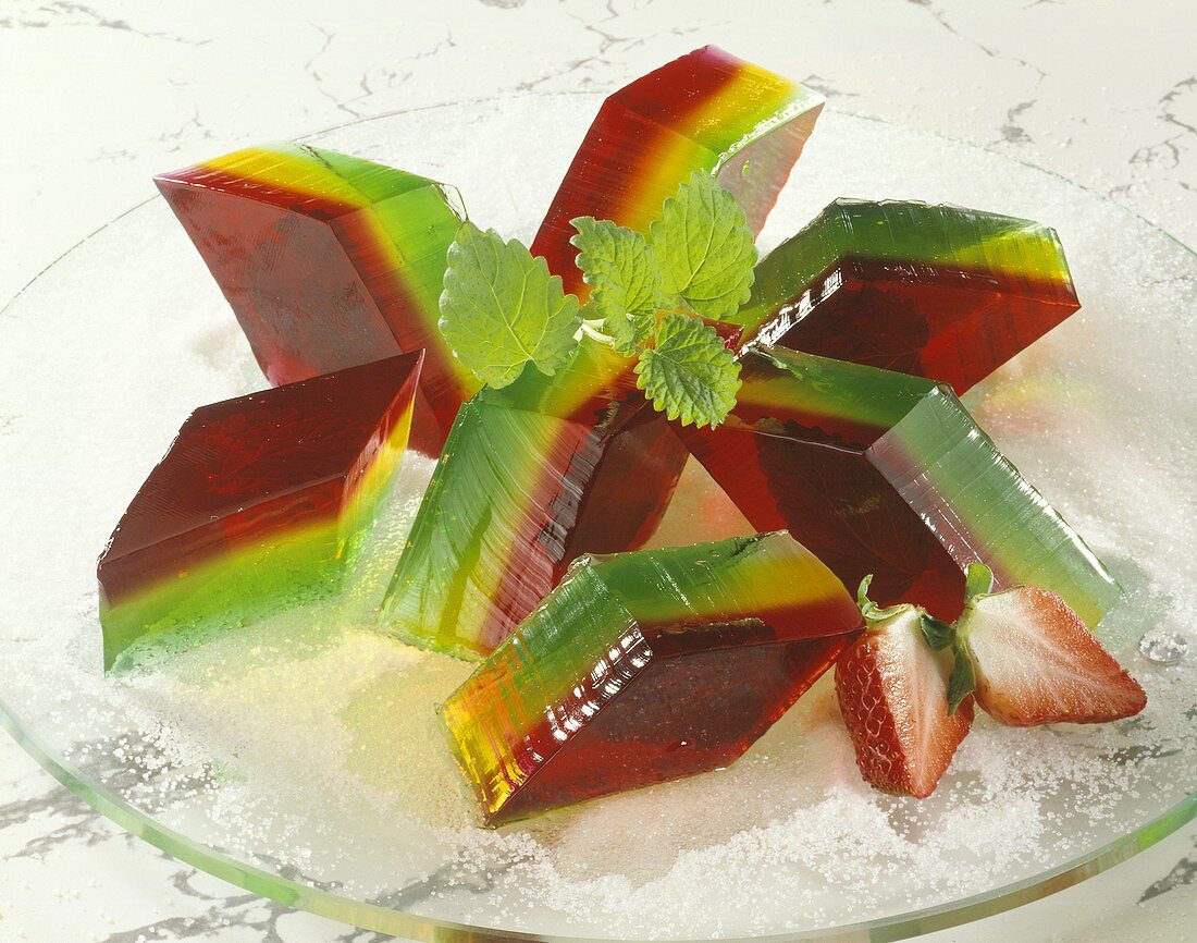 Three-coloured fruit jelly on sugar