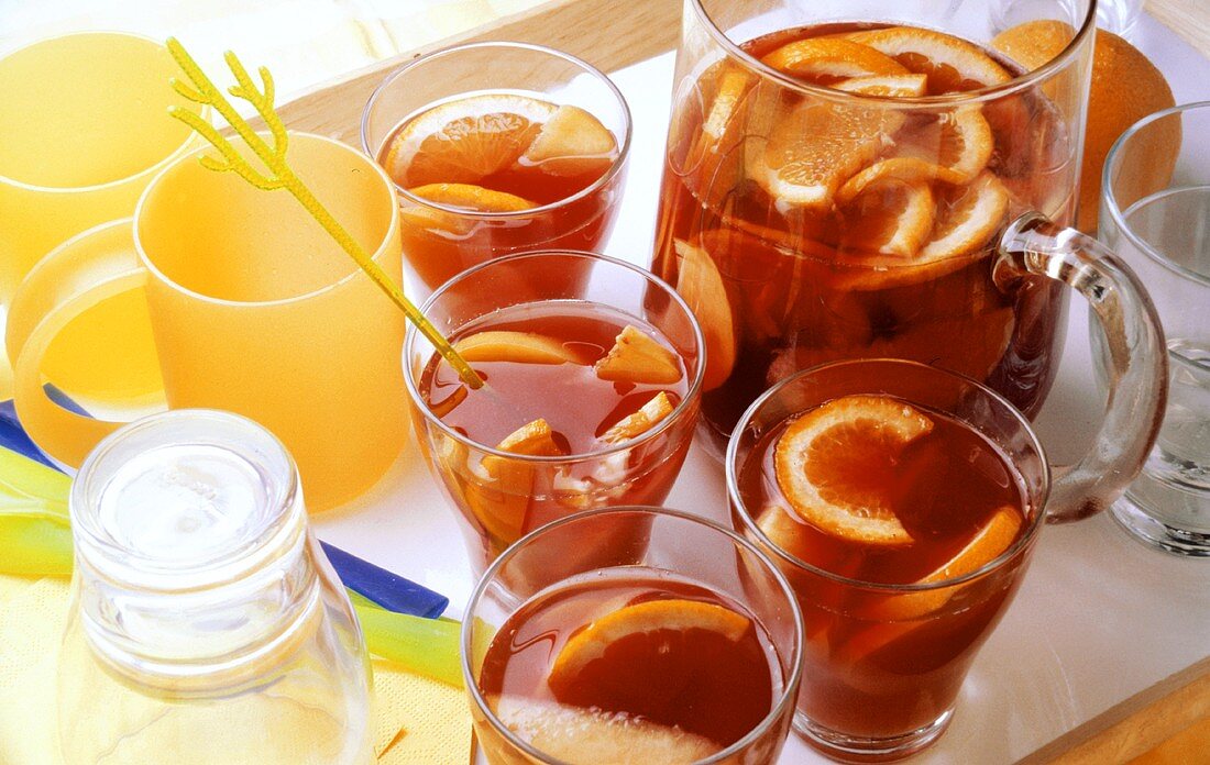 Orange punch in glasses and carafe