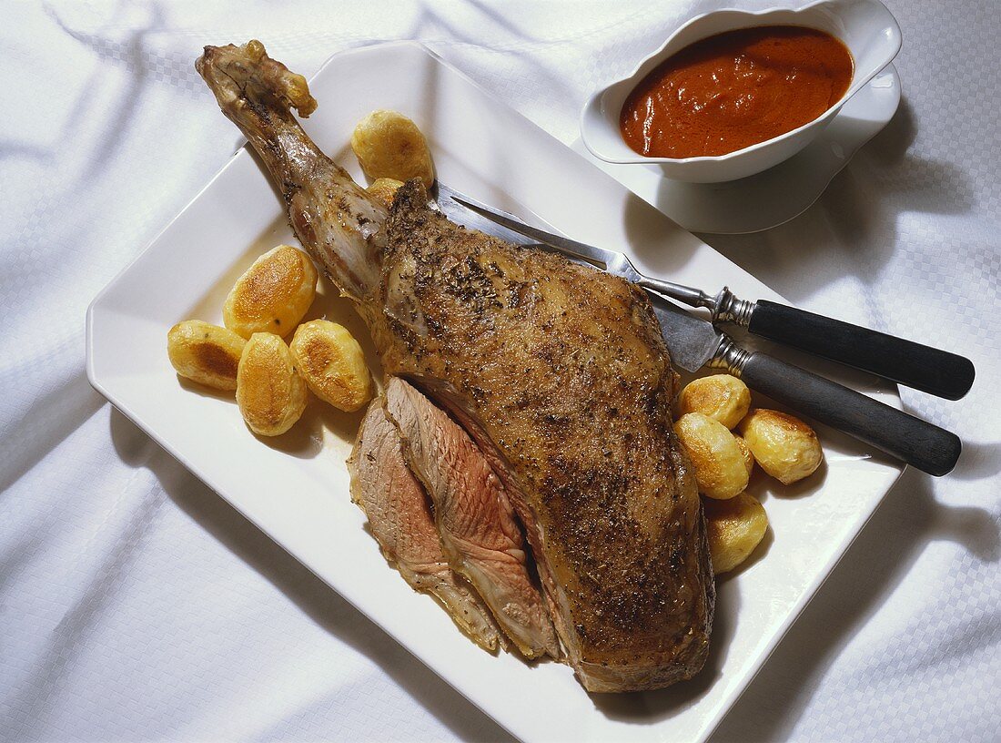 Leg of Lamb with Potatoes and Tomato Sauce