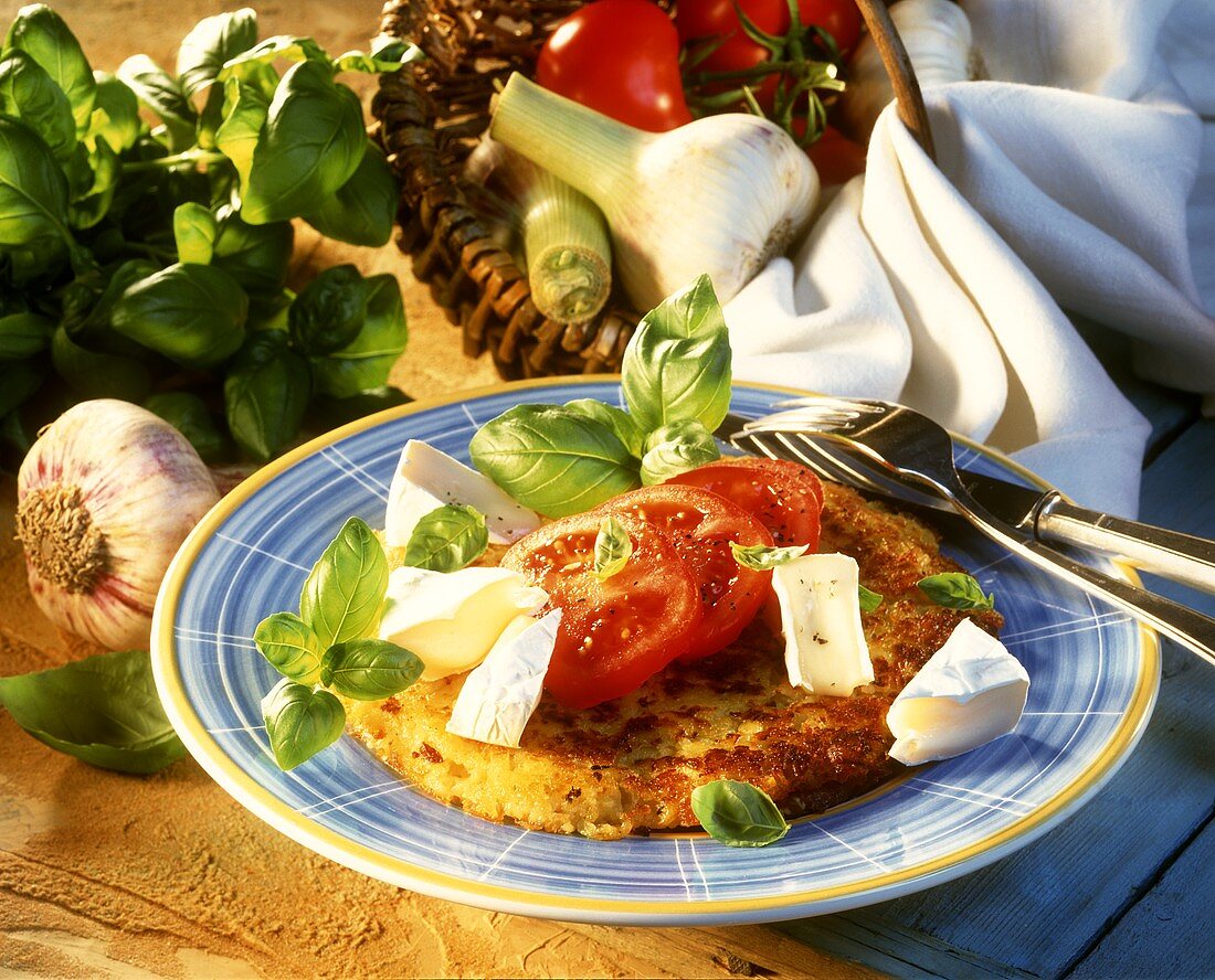 Garlic rosti with Camembert, tomatoes and basil