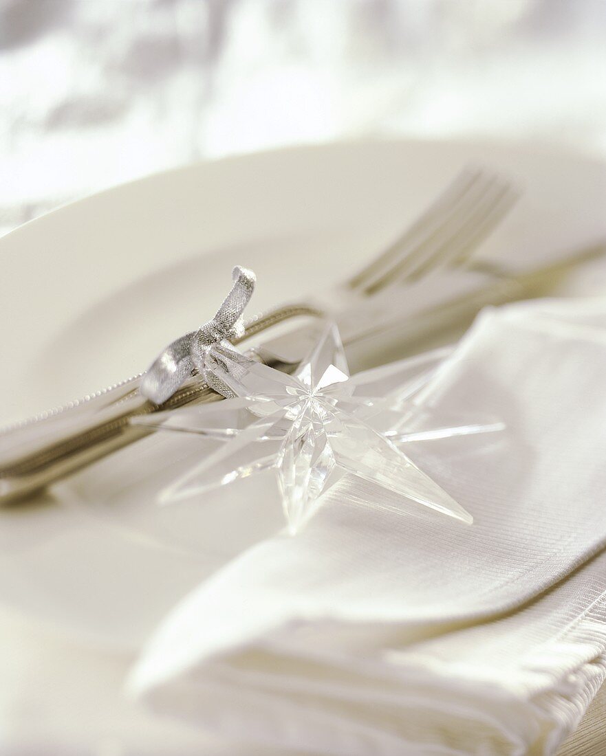 Cutlery decorated with plastic star for Christmas