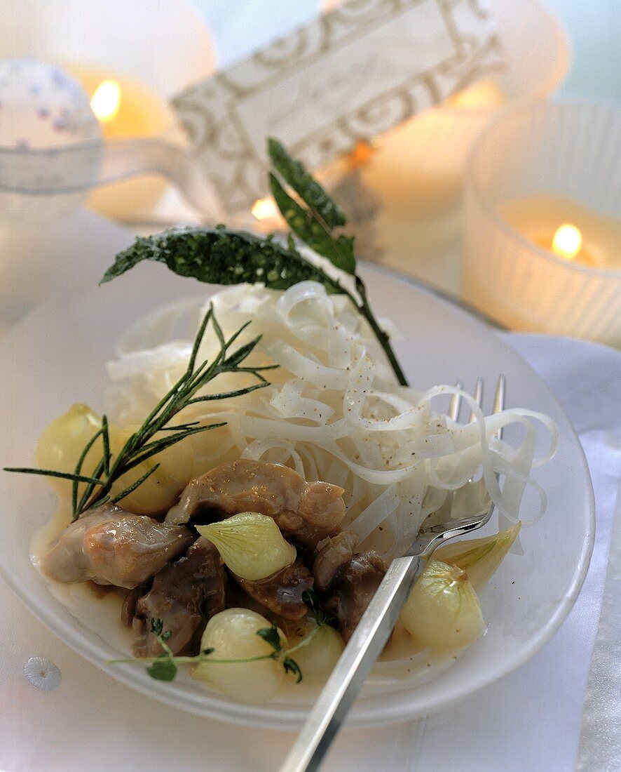 Guinea fowl ragout on rice noodles with pearl onions