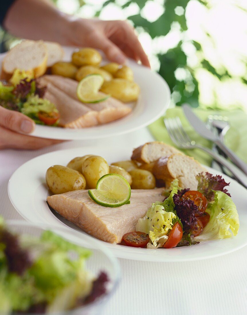 Poached salmon with potatoes and lettuce