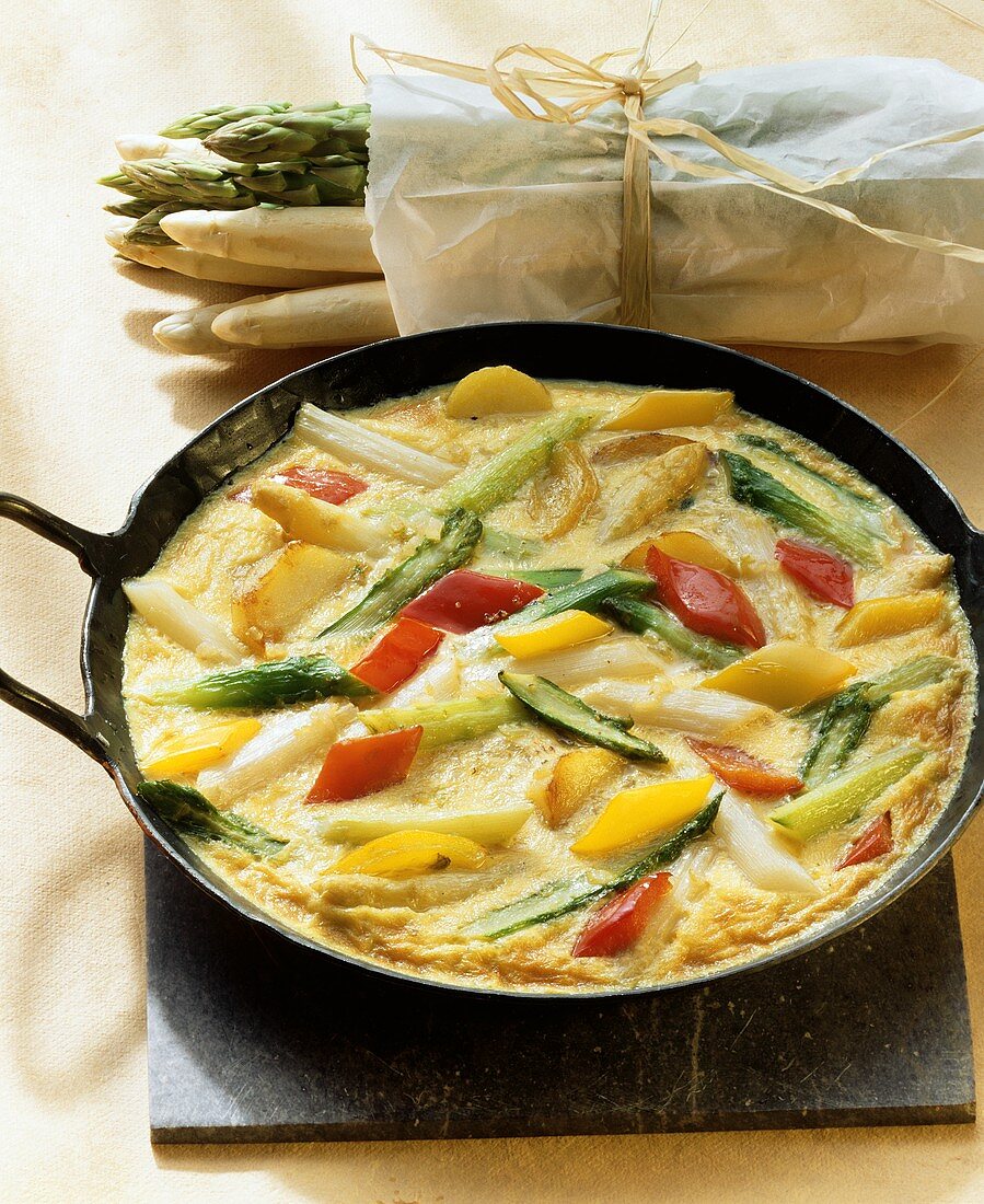 Colourful omelette with asparagus and peppers