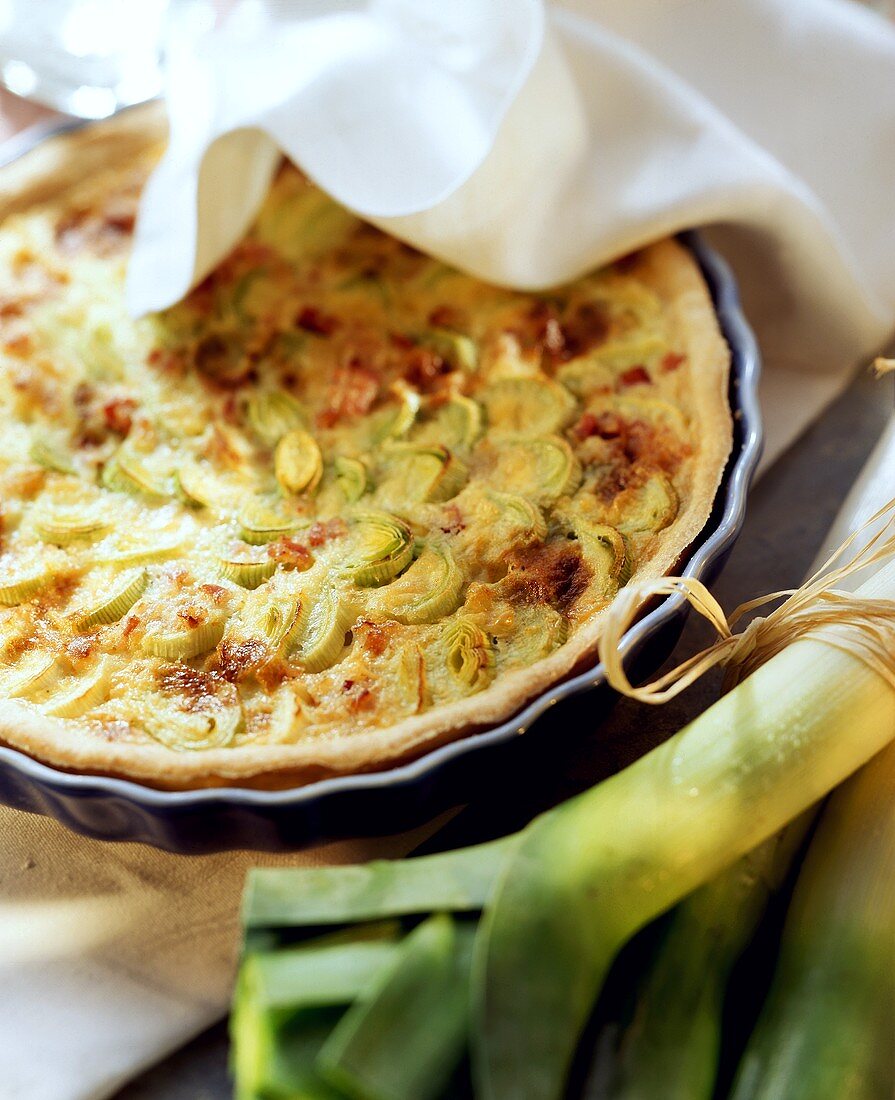 Leek quiche with bacon in a quiche dish