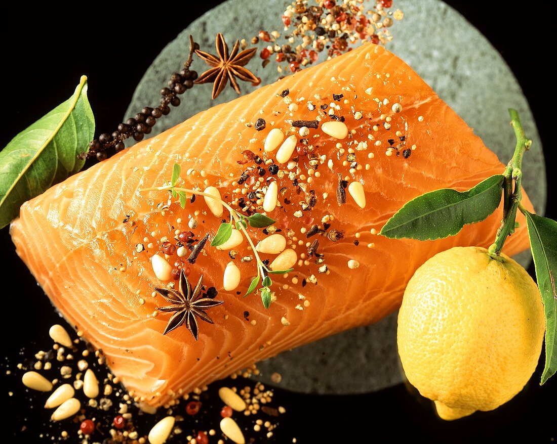 Salmon fillet with spices, a lemon beside it