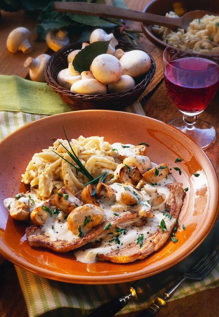 Pork escalope with homemade noodles & mushroom cream sauce