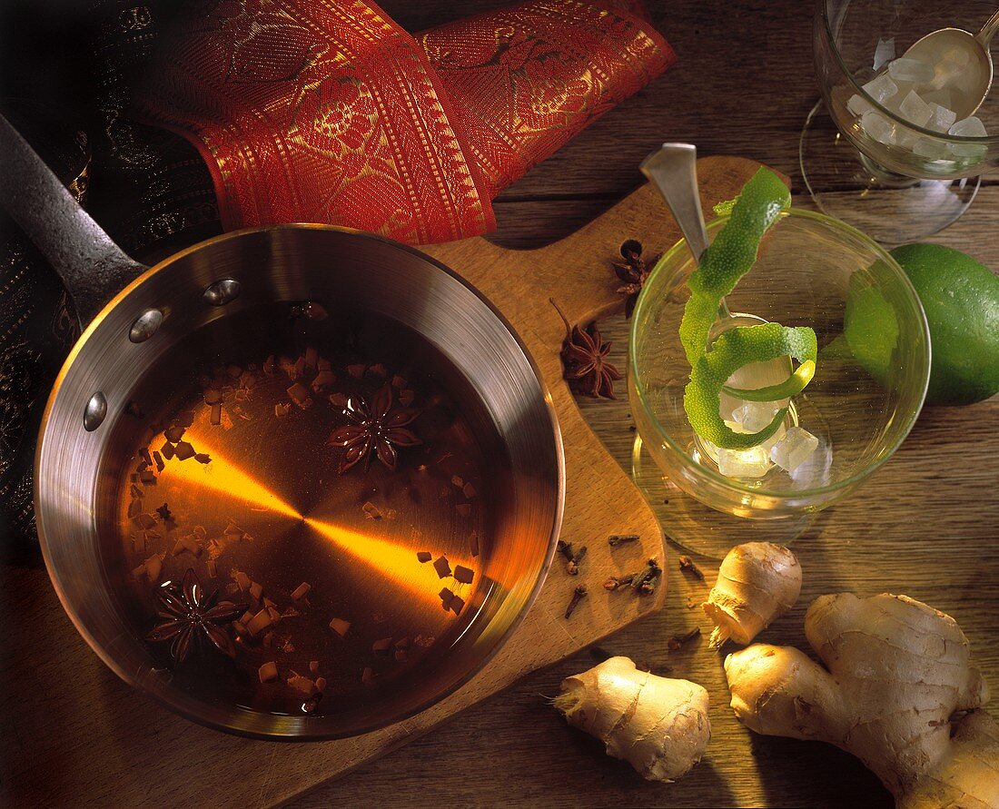 Tipsy ginger & tea punch in pan with ingredients