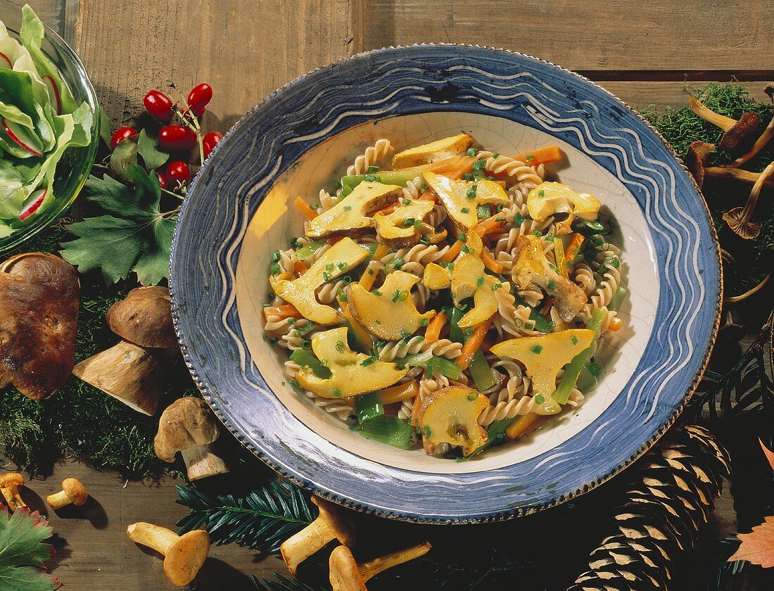 Pasta salad with mushrooms, décor: pine cones & mushrooms