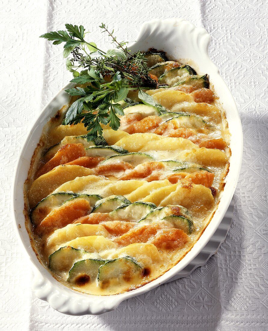 Vegetable gratin with potatoes, courgettes and carrots