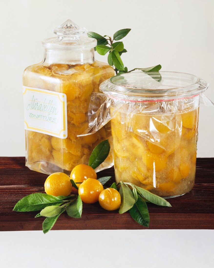 Mirabelle preserve in jars and a few mirabelles