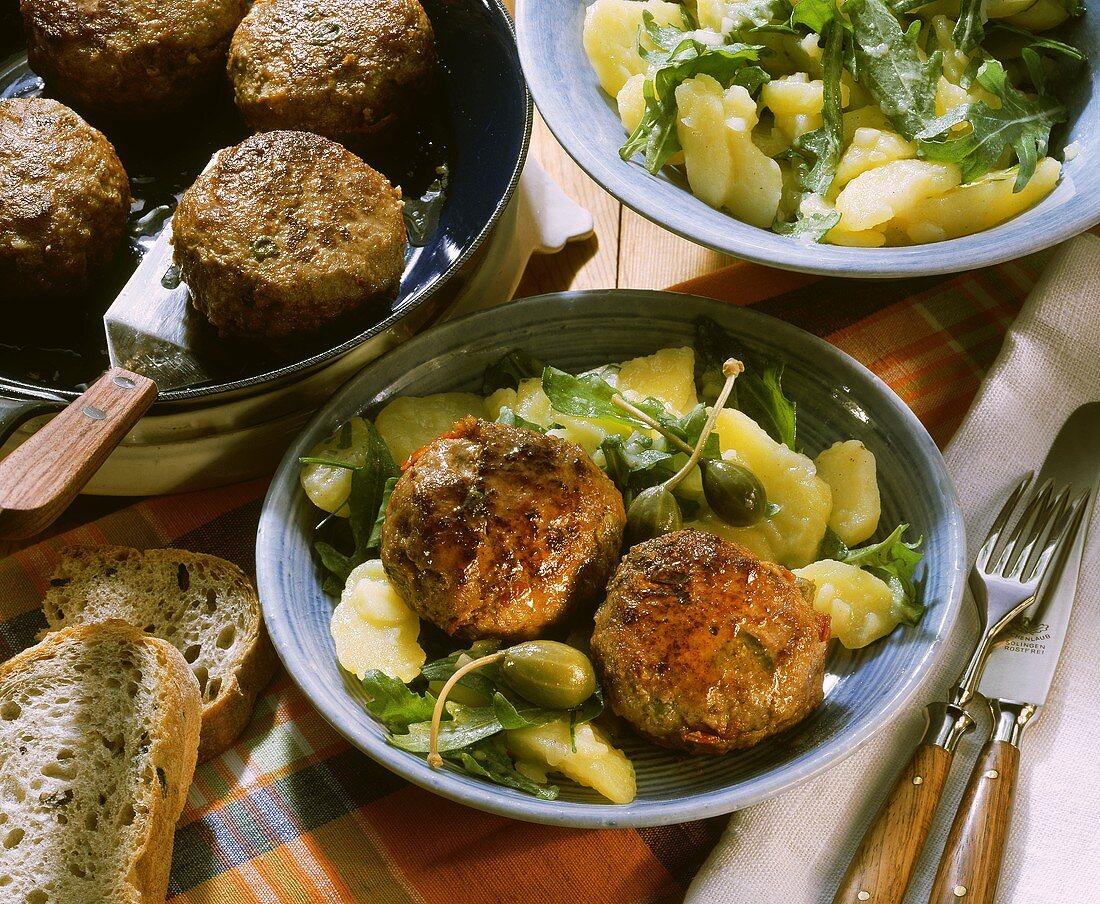 Frikadellas with capers & anchovies on potato salad