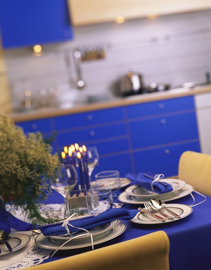 An Elegant Table Setting with Blue Napkins