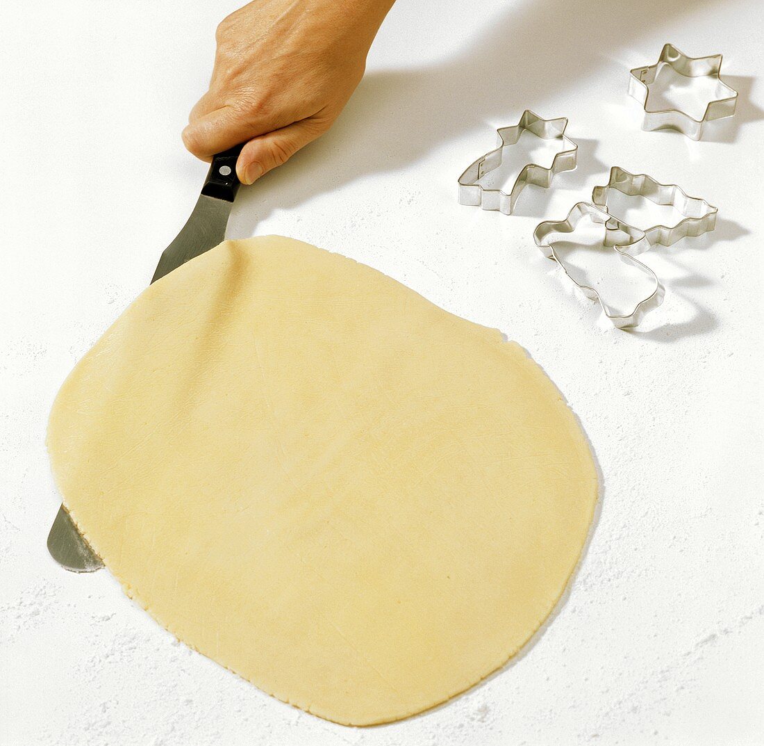 Loosening rolled out biscuit dough from board