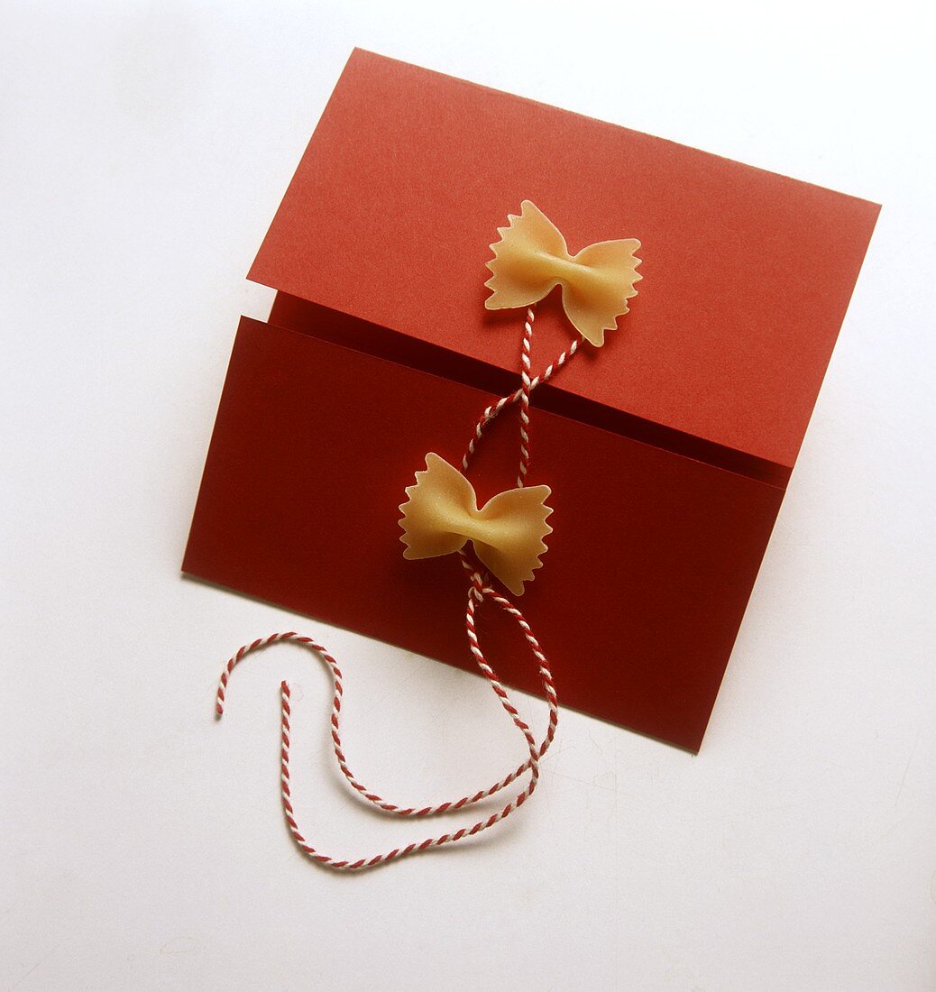 Invitation card decorated with farfalle
