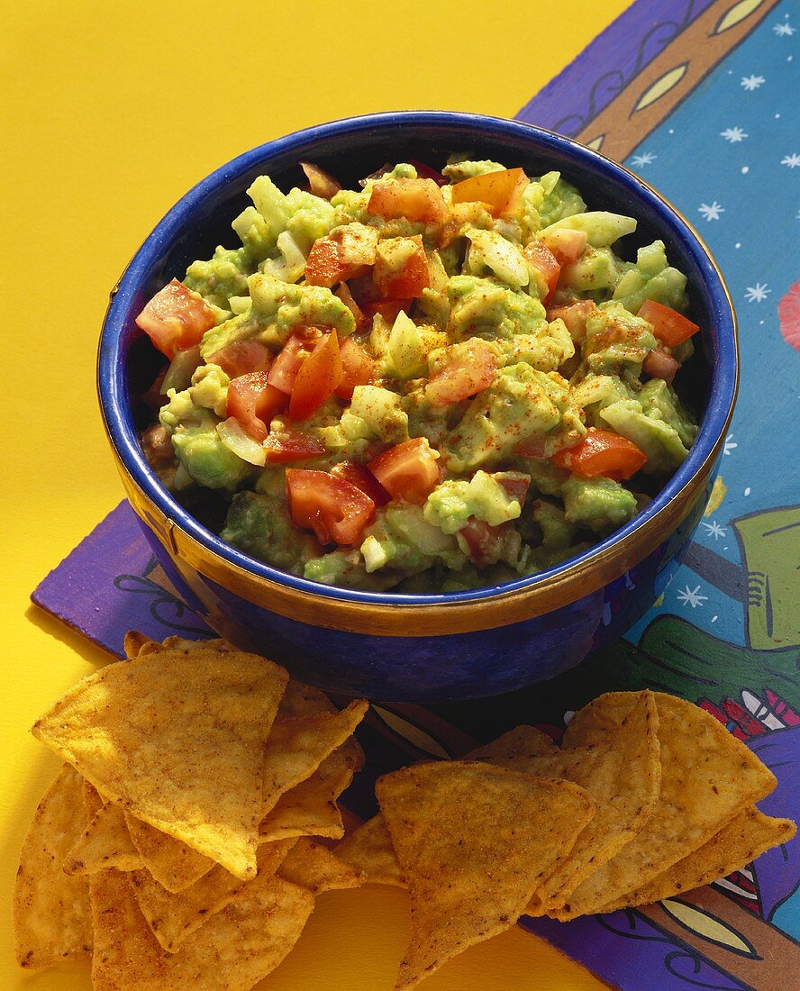 Guacamole with pieces of tomato