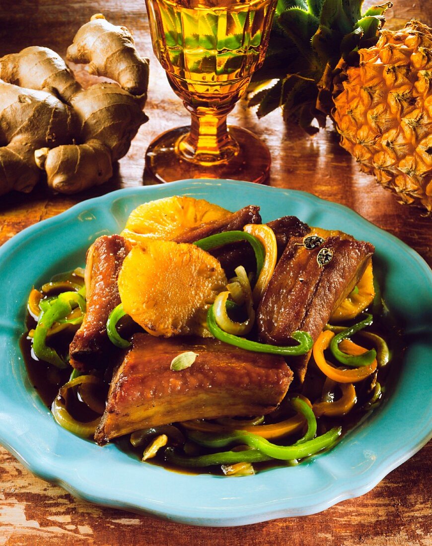 Chinese pork ribs on peppers with oranges