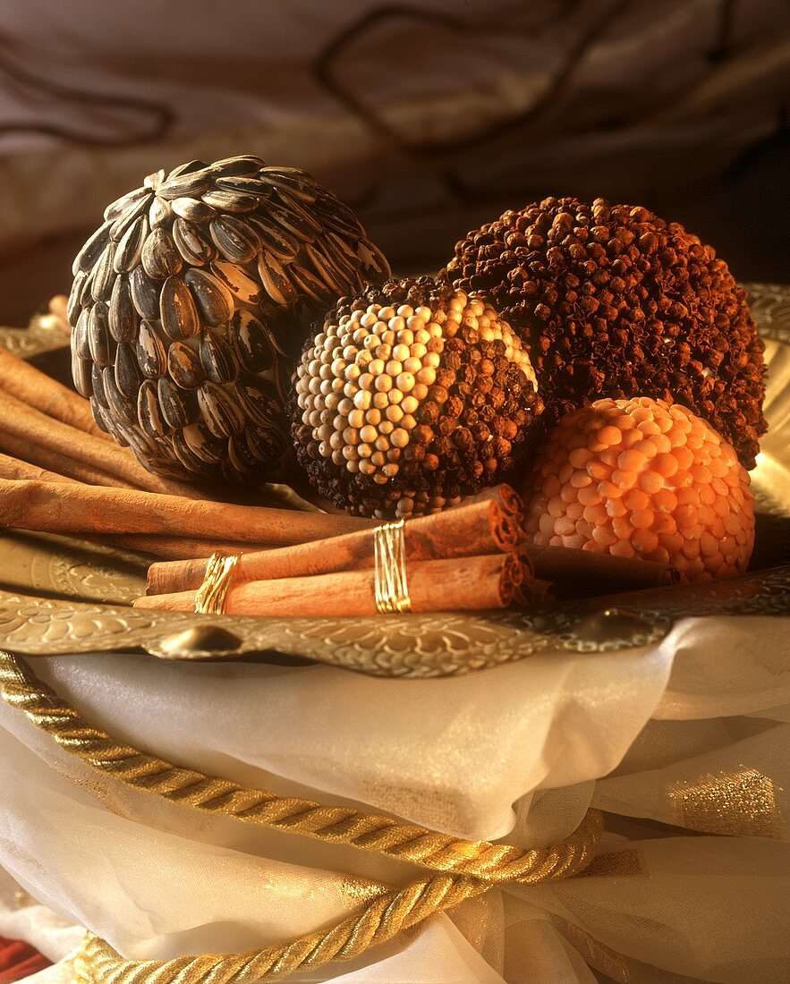 Decorative balls stuck with spices, seeds and lentils