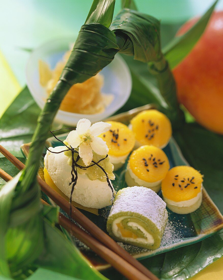 Various marzipan sushi with kiwi fruit and mango