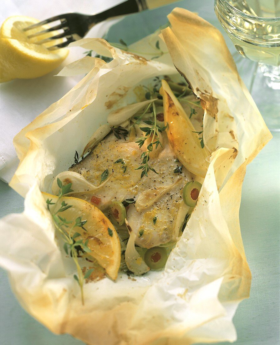 Halibut cutlets in baking parchment with thyme & olives