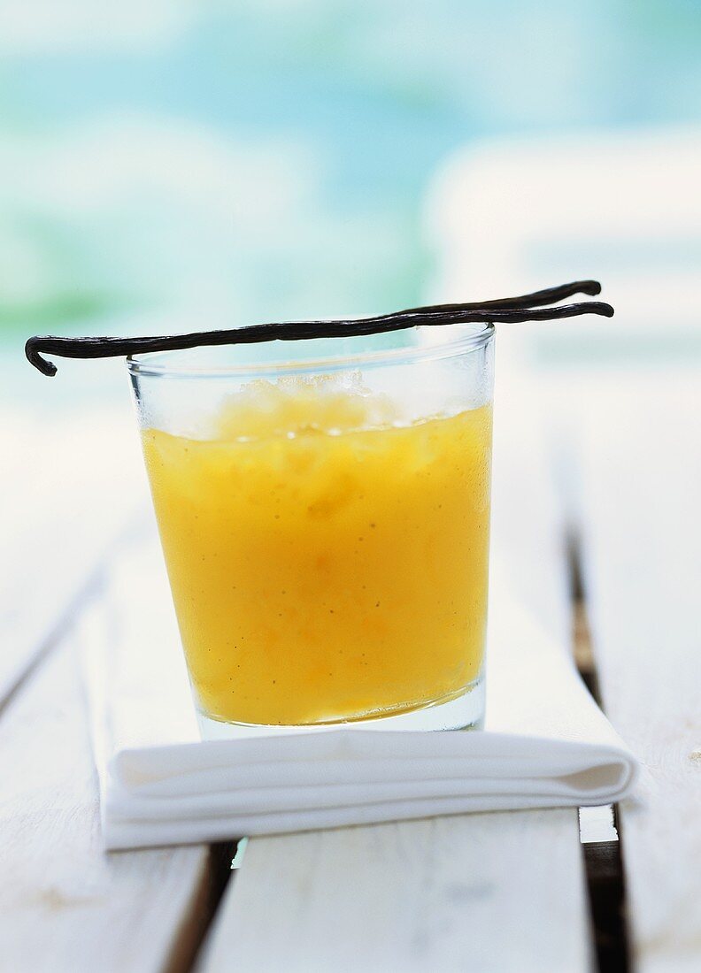 Mango drink with crushed ice and vanilla pods