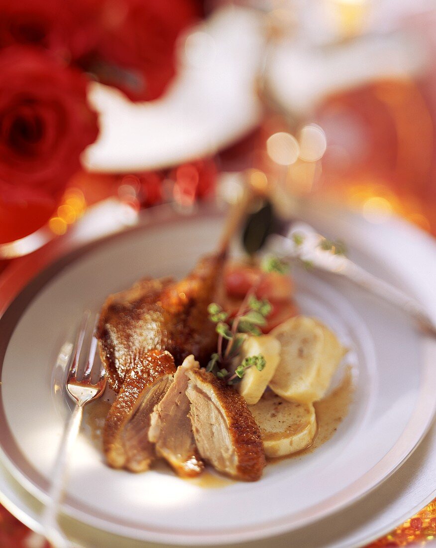 Duck with baked apple and dumpling slices