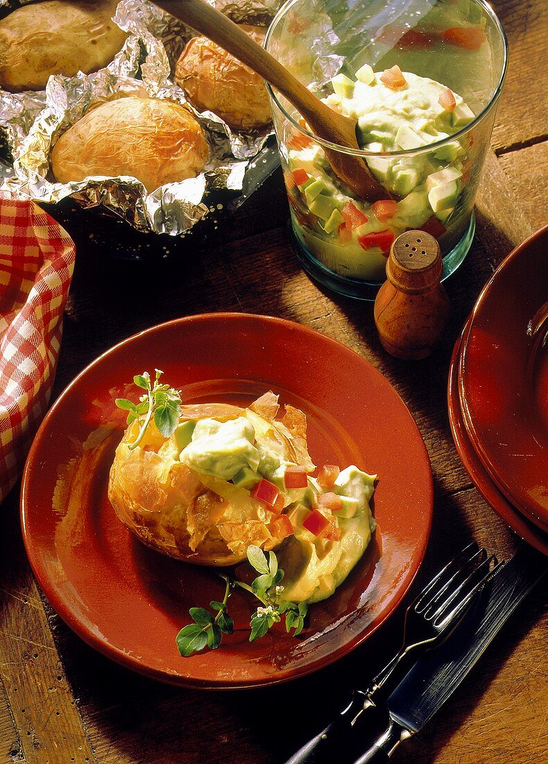 Baked potatoes stuffed with avocado mousse