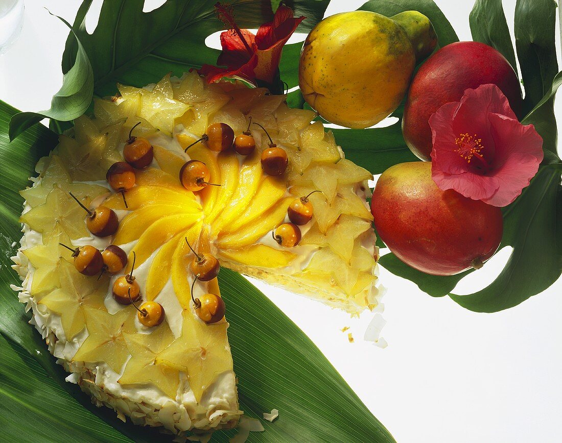 Exotic coconut gateau with carambolas, mangos & physalis