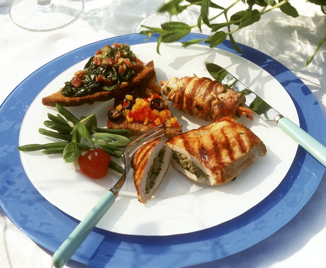 Plate of grilled foods and crostini