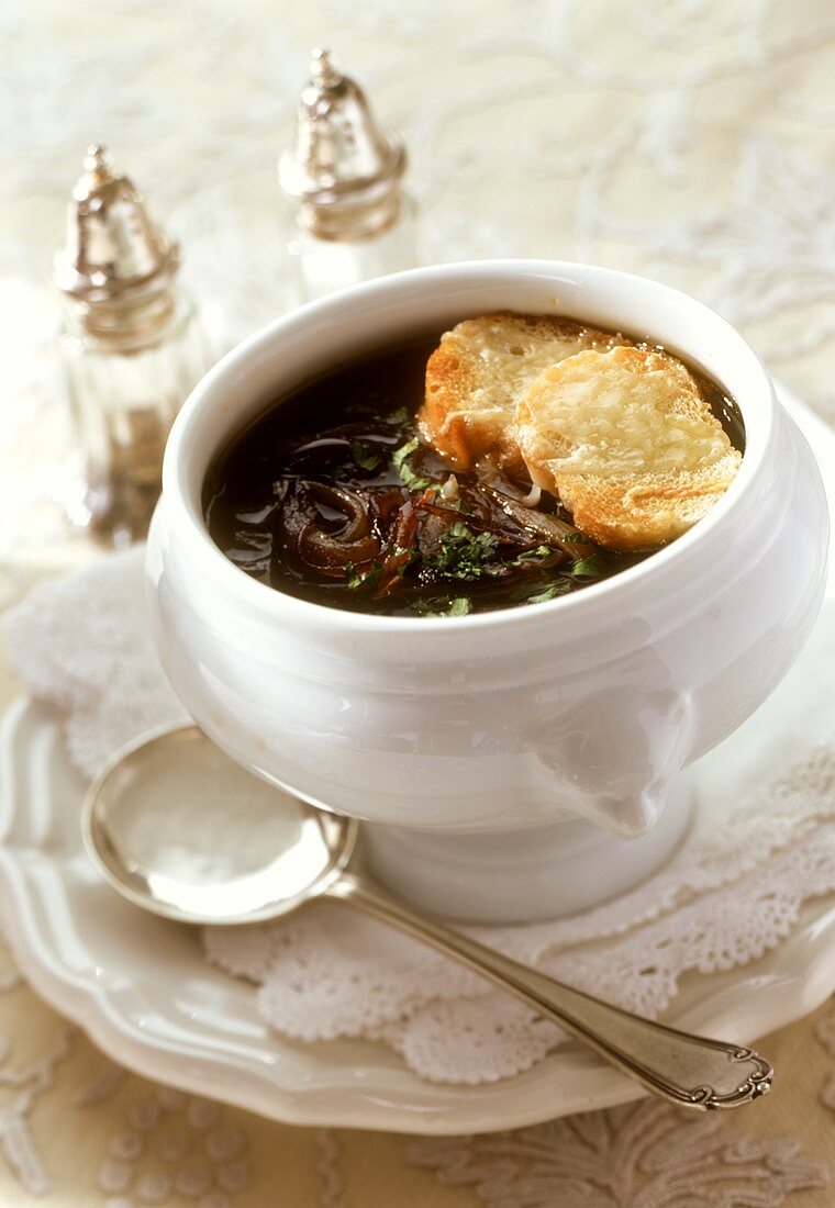 Onion soup with toasted slices of bread