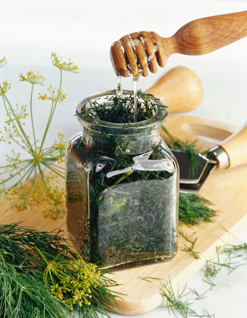 Dill with honey in preserving jar