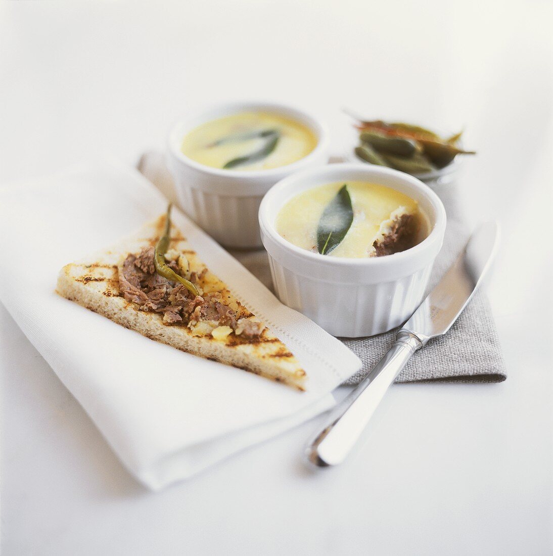 Duck rillette in bowl and on toast