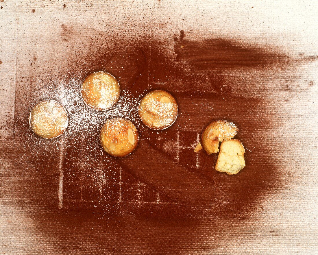Muffins on a background of cocoa powder