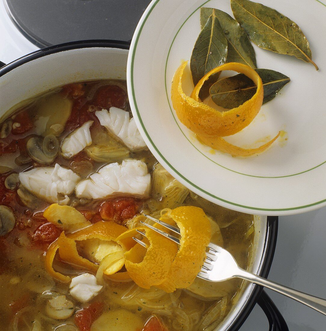 Refining fish stew with orange peel