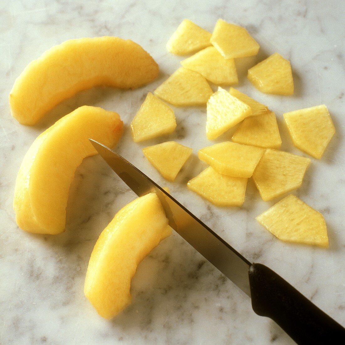Chopping peach slices