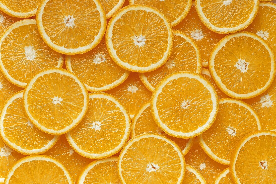 Many orange slices (filling the picture)