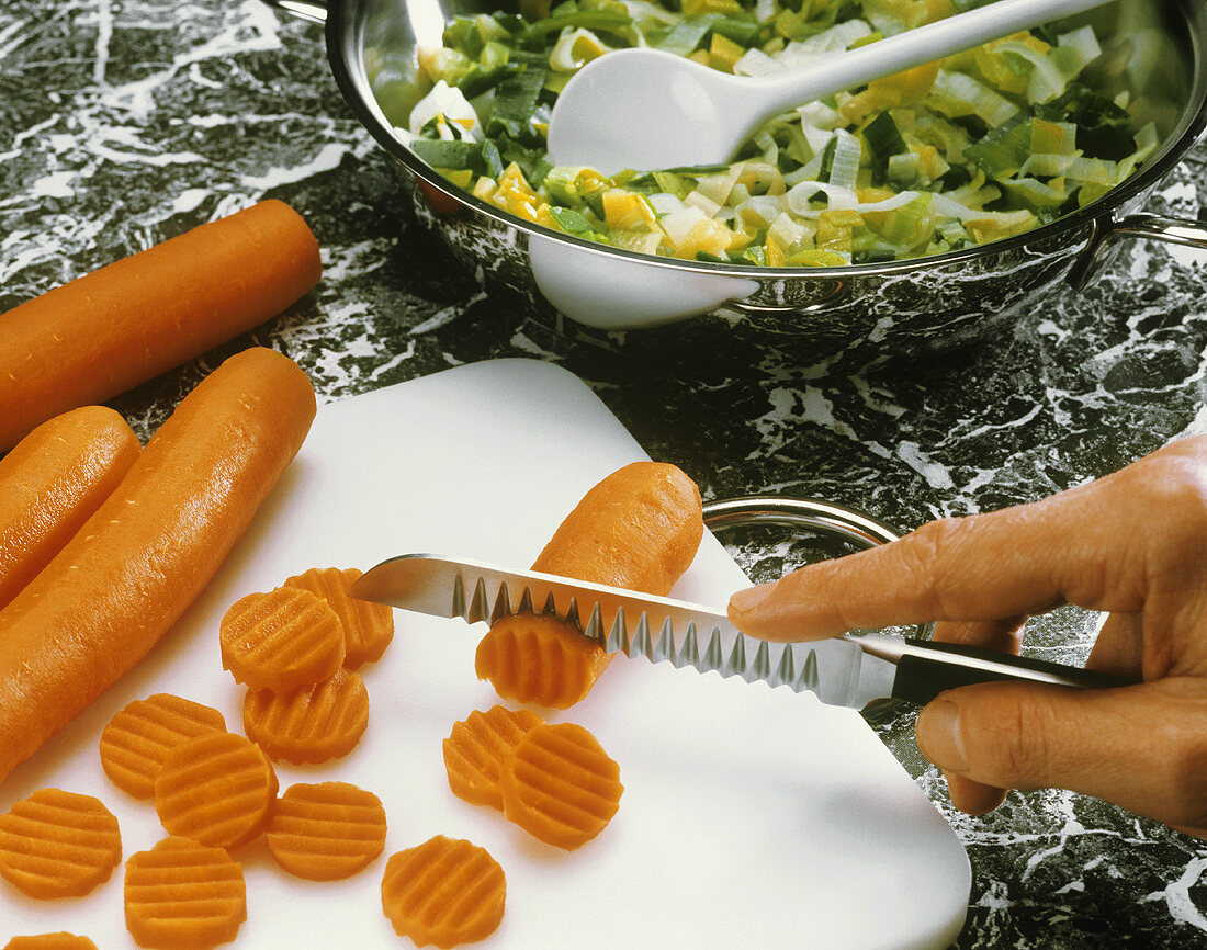 Slicing carrots with garnishing knife