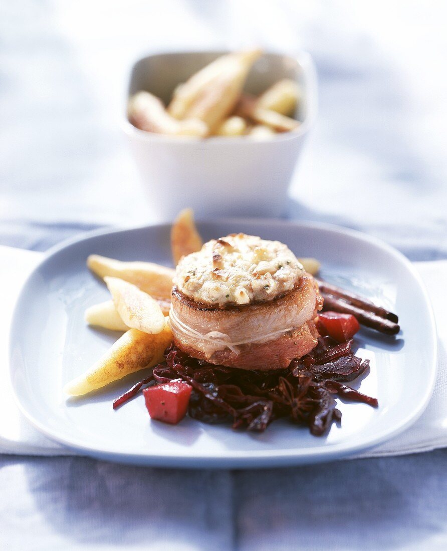 Ostrich medallions with nut topping wrapped in bacon