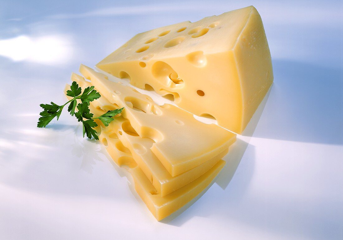 Emmental cheese, a piece and sliced