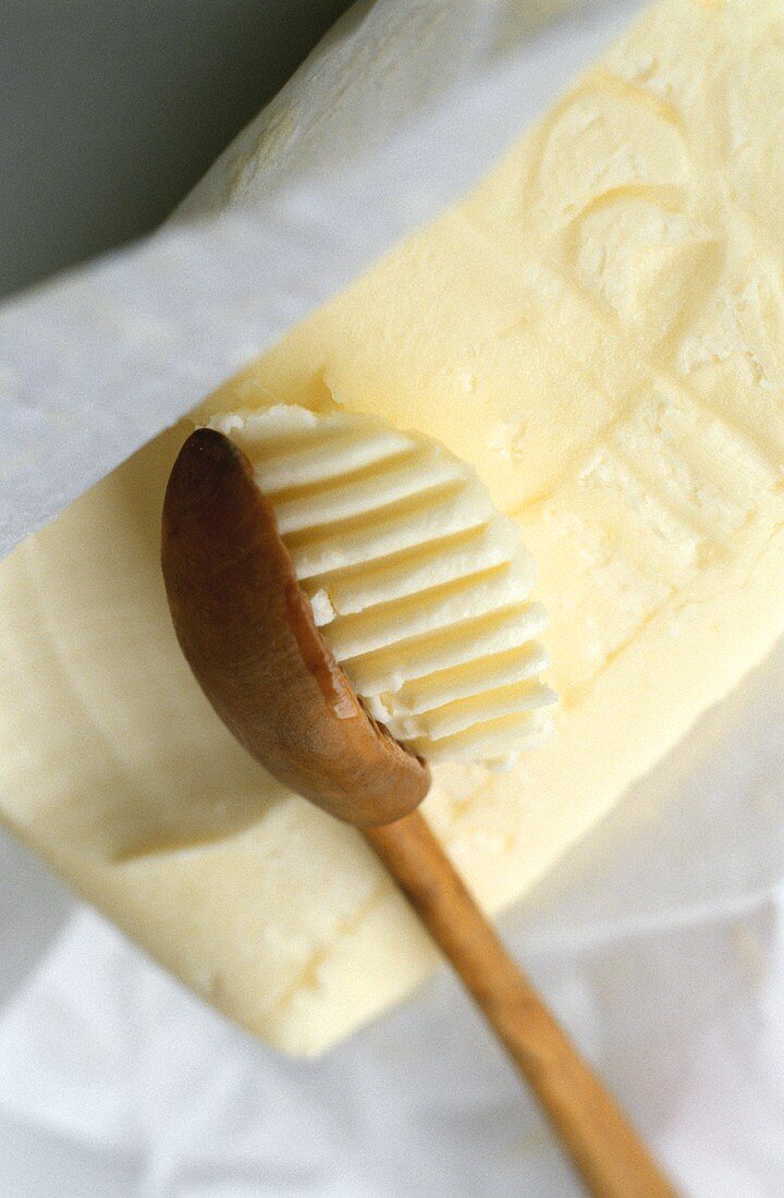 Butter with grooved wooden spoon
