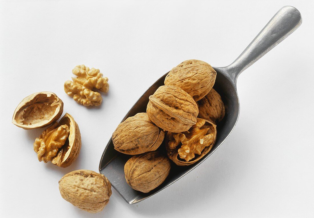 Walnuts on and beside a scoop