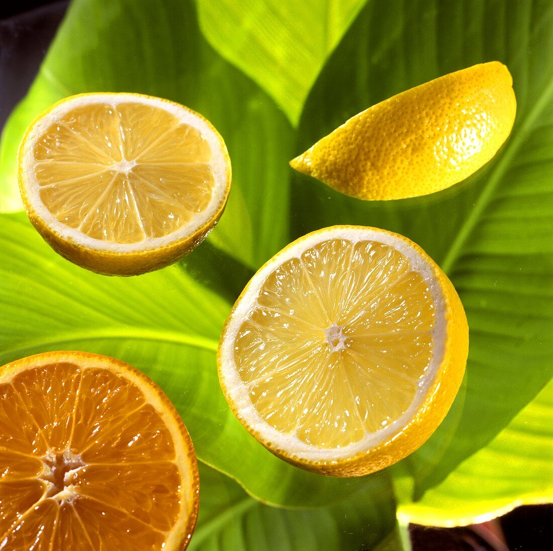 Citrus fruits on banana leaves