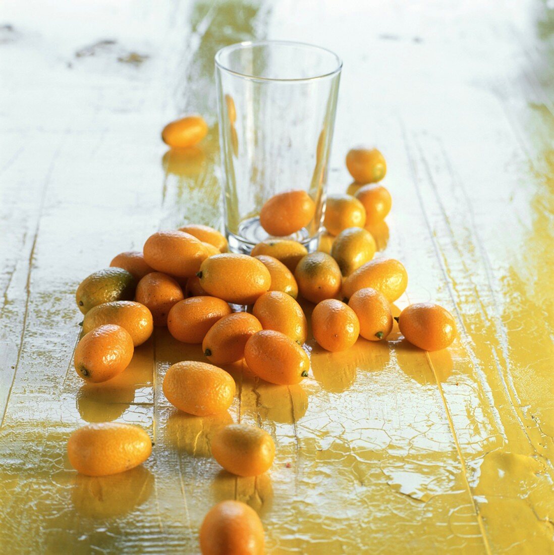 Kumquats and a glass