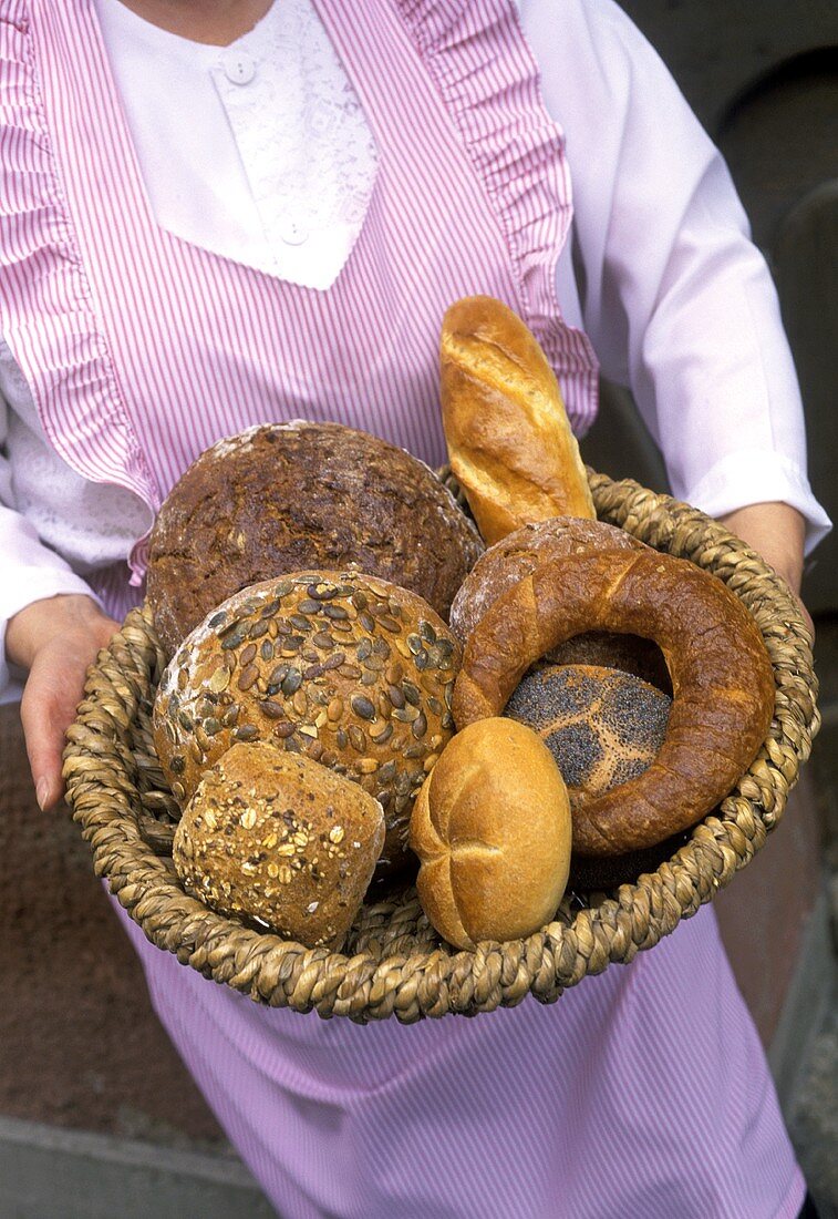 Woman Holding Baked Breads
